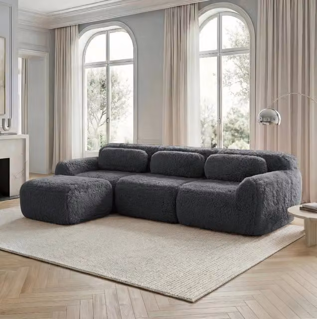 Divano modulare angolare 291.0x179.0x73.0 cm con pouf collegabile in peluche grigio