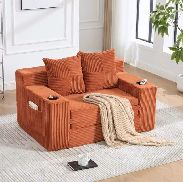 Divano pouf in velluto a coste arancione con tasche laterali e 2 cuscini; 151 x 133 x 64 cm