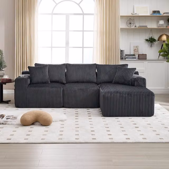 Divano modulare MIVRAY a L con chaise longue, rivestimento in velluto a coste grigio, completo di 5 cuscini, tasche laterali e portabevande, L/P/H: 257 x 162 x 90 cm