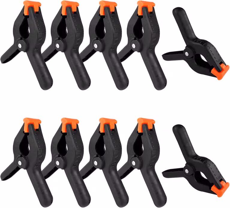 Set di morsetti a molla, composto da 10 pezzi, realizzati in nylon nero con ganasce mobili e zigrinate, ideali per lavori in legno