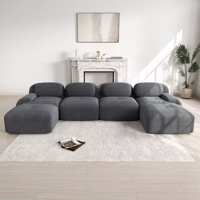 Divano 3 posti Minimal grigio in tessuto imbottito con braccioli larghi e design a L per il tuo soggiorno