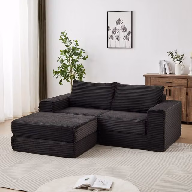 Divano letto modulare Mivray in velluto a coste nero con poggiapiedi coordinato e funzione notte per soggiorno