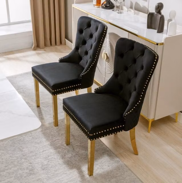 Sedia da pranzo in velluto nero con gambe in acciaio inox placcato oro