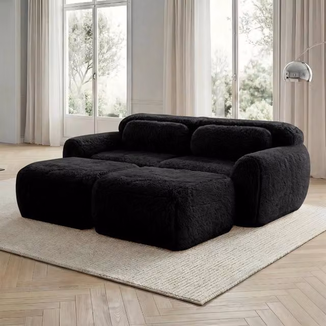 Divano angolare modulare reversibile MIVRAY nero con pouf coordinato per soggiorno