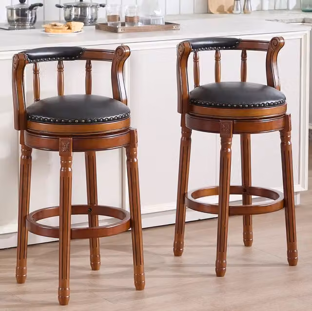 Sgabello da bar girevole 360° con schienale; seduta in vera pelle nera; altezza 29;5”