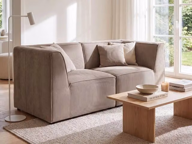 Divano modulare Beliani beige in velluto con funzione letto e pouf coordinato per soggiorno – 1