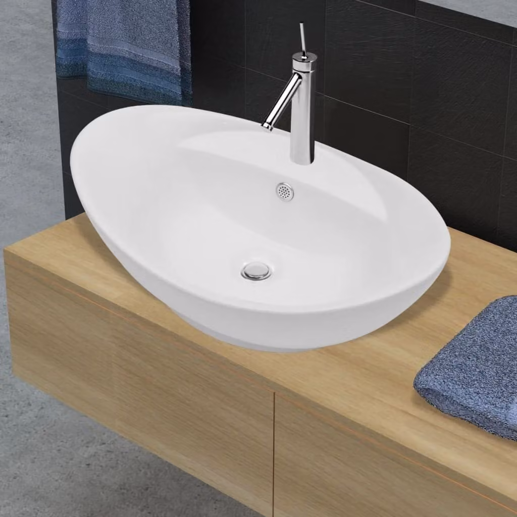 Lussuoso lavabo ovale in Vetroceramica con troppopieno e foro per rubinetto