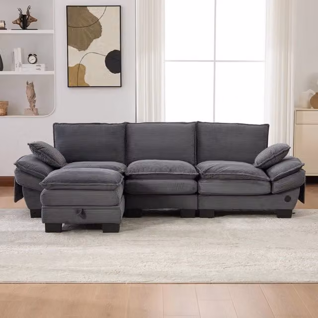 Divano modulare a L Mivray in velluto a coste grigio con pouf coordinato e ricarica USB