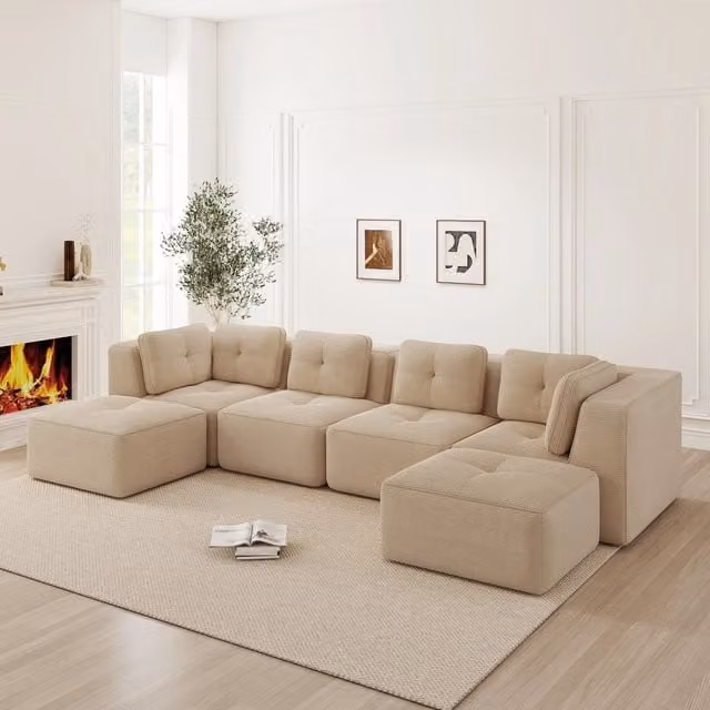 Divano angolare modulare OKWISH in velluto beige con seduta profonda e cuscini inclusi