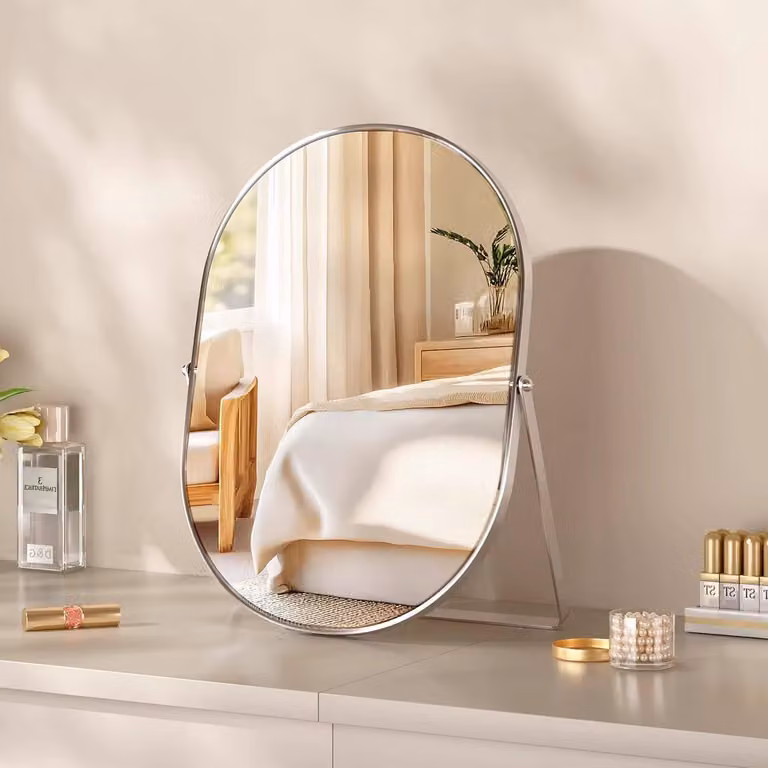 Specchio ovale da trucco autoportante con cornice in metallo