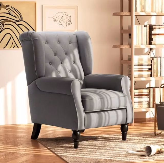 Poltrona imbottita grigio scuro con gambe in legno