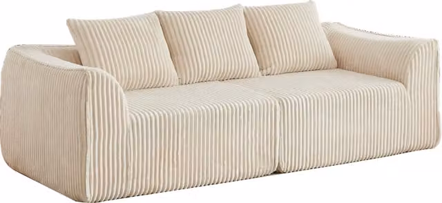 Divano modulare con schienale e braccioli curvi, seduta ampia e due cuscini in velluto a coste beige