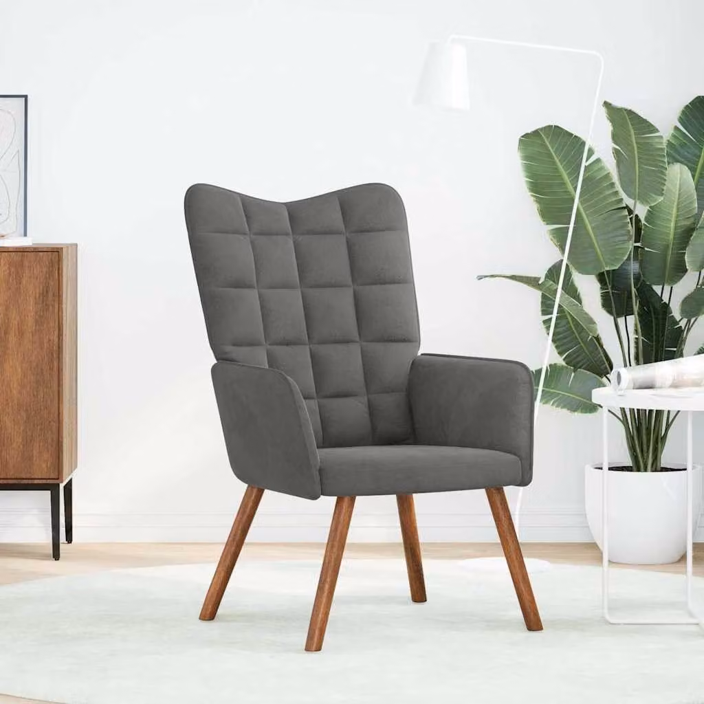 Poltrona in velluto grigio scuro, ideale per il relax e il comfort
