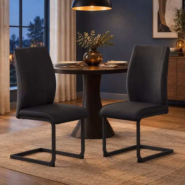 Set di 2 sedie da pranzo ULEVR nere in similpelle con schienale ergonomico e struttura in metallo