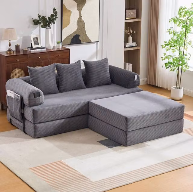Divano modulare in velluto a coste con pouf; struttura in metallo e tasca laterale; grigio scuro