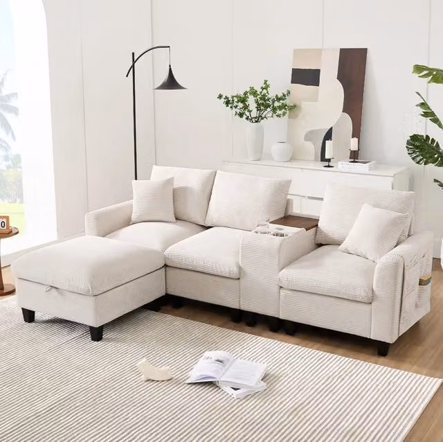 Divano angolare 229x149.5x83 cm con console centrale; porte USB e tasche portaoggetti in corduroy beige