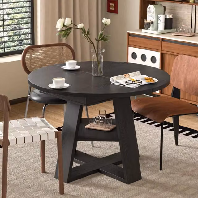 Tavolo da pranzo rotondo allungabile 110/150x110 cm in MDF nero con vano porta prolunga