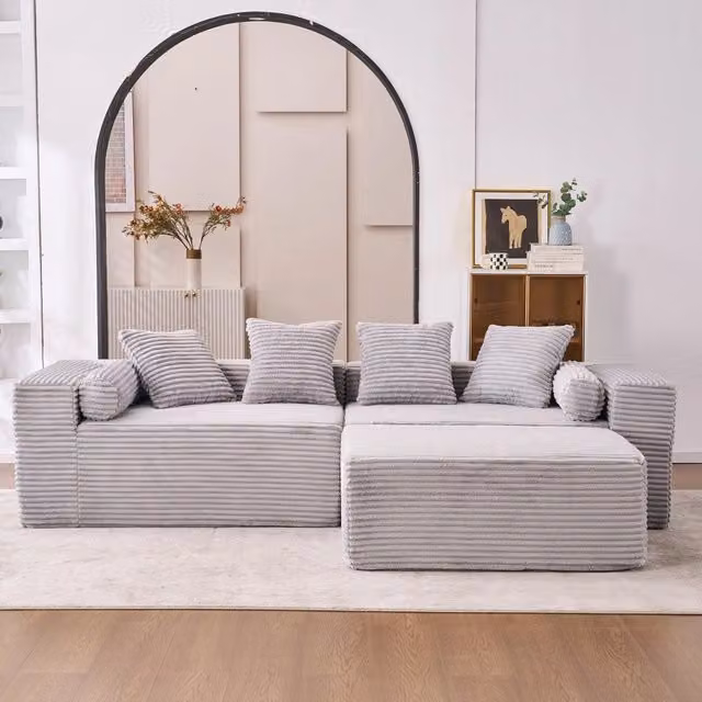 Divano angolare modulare senza attrezzi con chaise longue e seduta oversize per salotto in tessuto chenille grigio