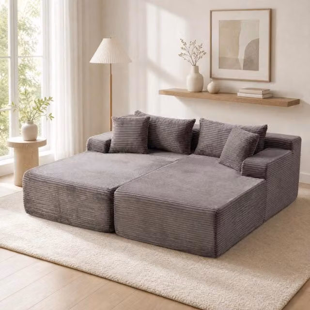 Divano con chaise longue e cuscino in ciniglia grigio
