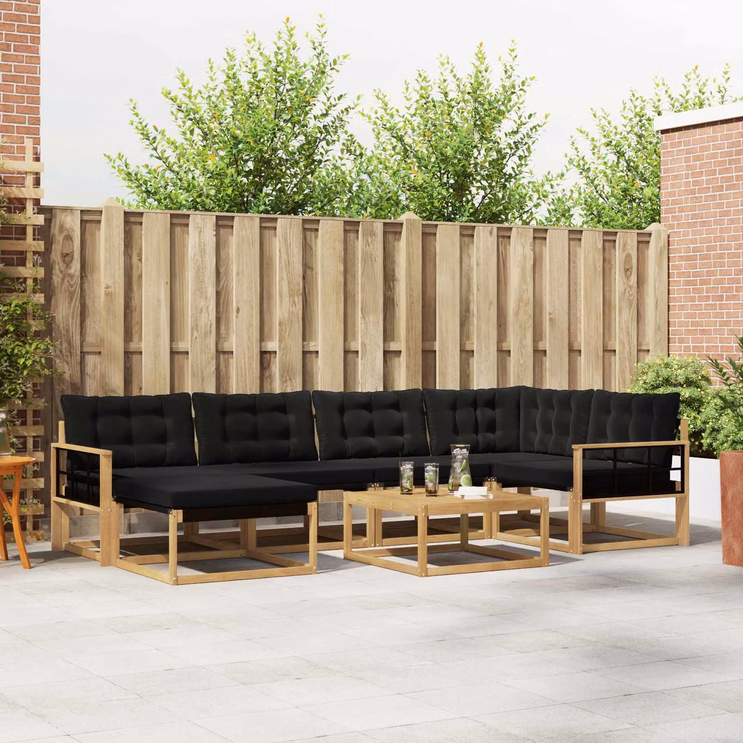 Set di divani da esterno vidaXL 7 pz in legno di acacia con cuscini bianchi e neri per giardino e terrazza