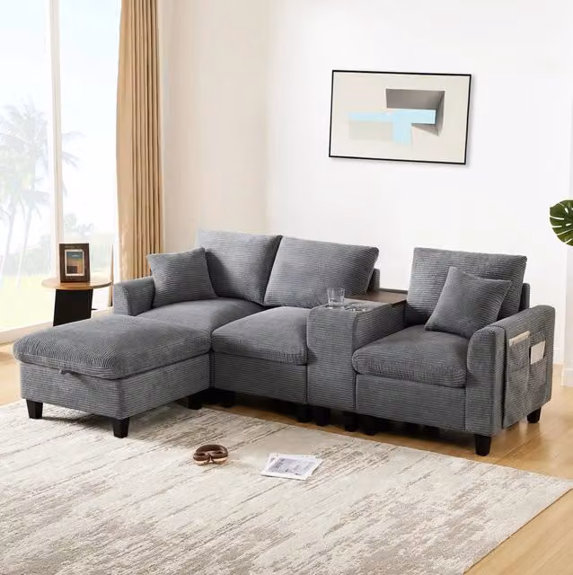 Divano angolare L 229x149.5x83 cm con console centrale; porta bicchieri e USB in velluto a coste grigio