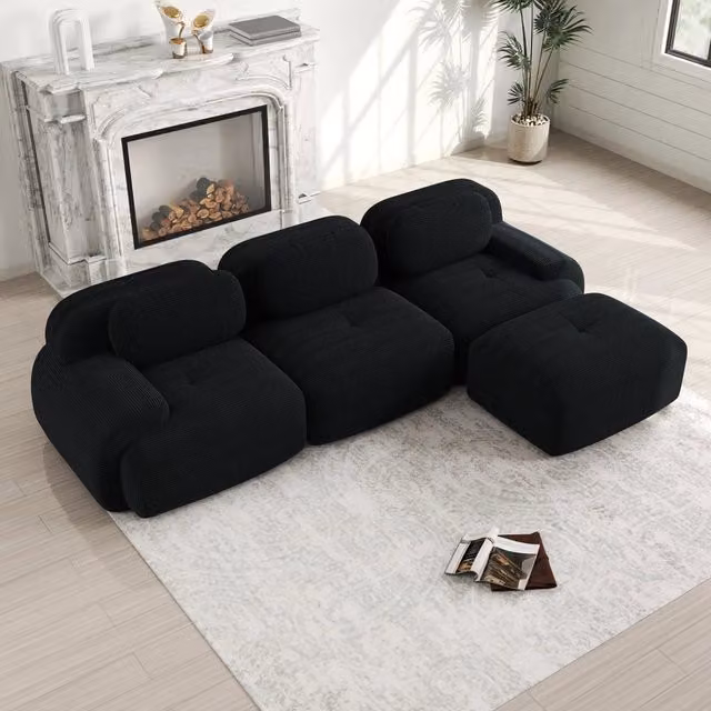 Divano angolare modulare senza montaggio in velluto a coste con braccioli ampi ed ergonomico nero