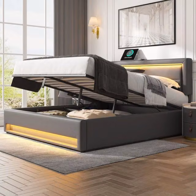 Letto imbottito 140 x 190 cm; spazio contenitore; LED; porta USB; ricarica wireless e cablata; PU; grigio