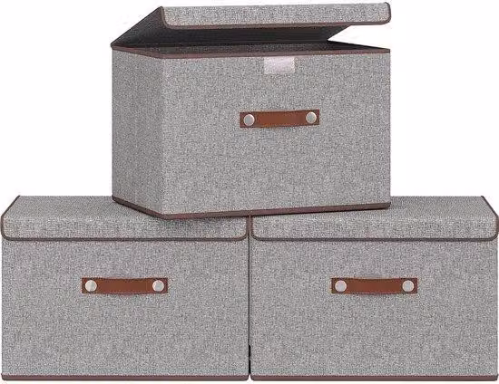 Set composto da tre contenitori pieghevoli in tessuto con coperchio e manici