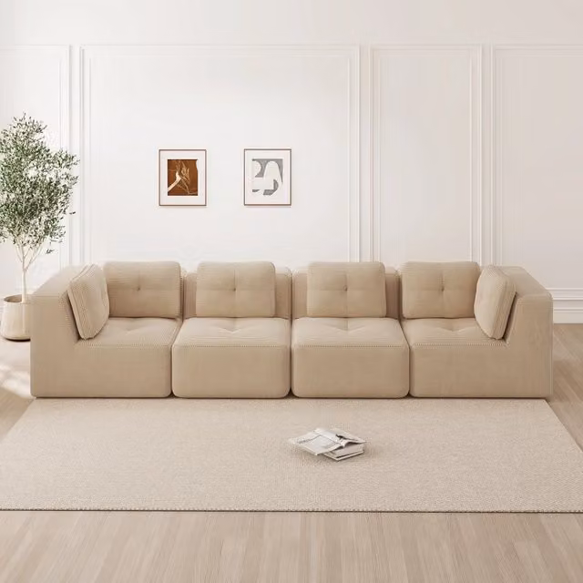 Divano angolare modulare Mivray in velluto a coste beige con design moderno e struttura imbottita