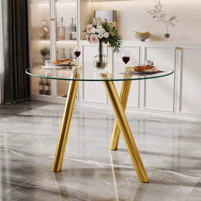 Tavolo da pranzo rotondo in vetro temprato con struttura in metallo color oro