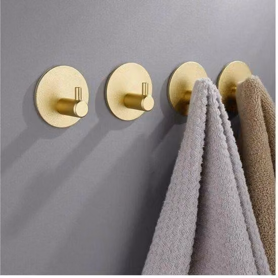 Set di ganci in acciaio inossidabile composto da quattro pezzi, color oro, stile moderno, 5x5x2,6 cm.