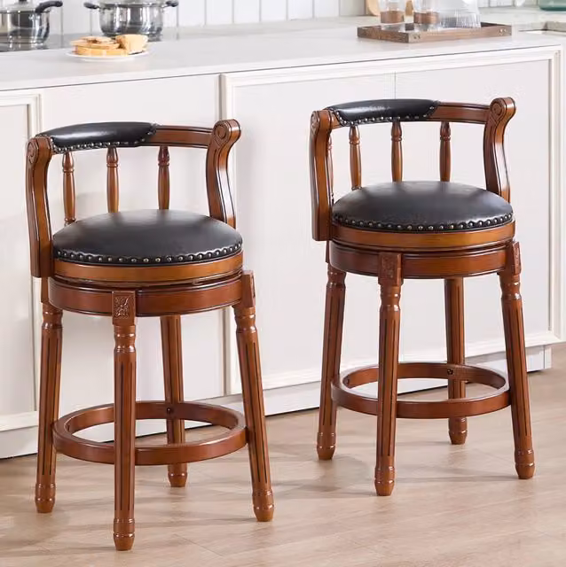 Sgabello da bar girevole a 360° in vera pelle e legno nero; altezza seduta 26”