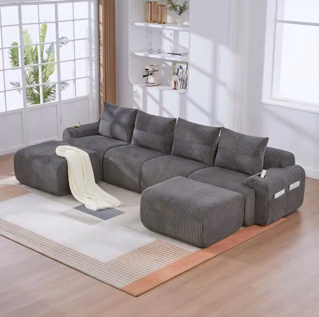 Divano modulare ULEVR 4 posti 333x174x80 cm con 2 pouf, portabicchieri e tasca laterale, velluto a coste grigio scuro