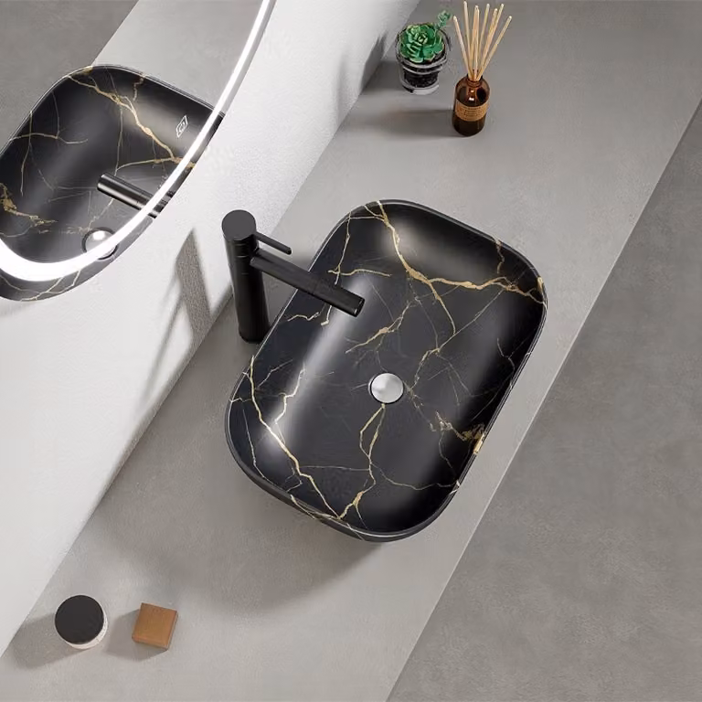 Lavabo da appoggio in marmo nero I e base ovale in Vetroceramica 46,5x33 cm