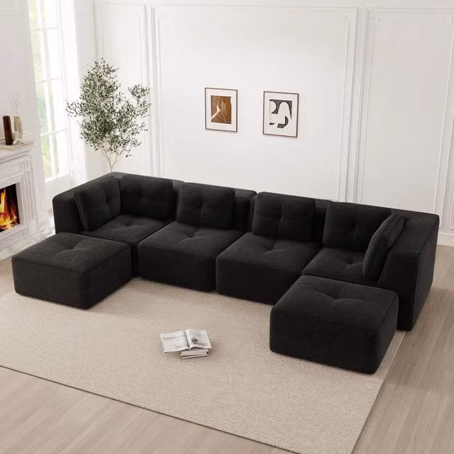 Divano angolare modulare OKWISH in velluto a coste nero con seduta profonda e braccioli larghi