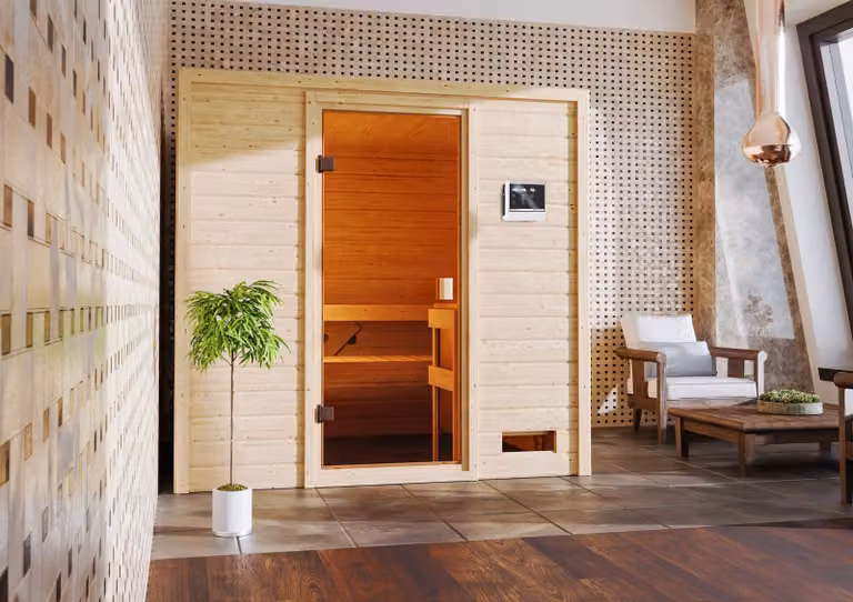Sauna Woodfeeling Adelina (ingresso frontale), porta a tutto vetro, bronzata, riscaldatore 9 kWa controllo esterno semplice