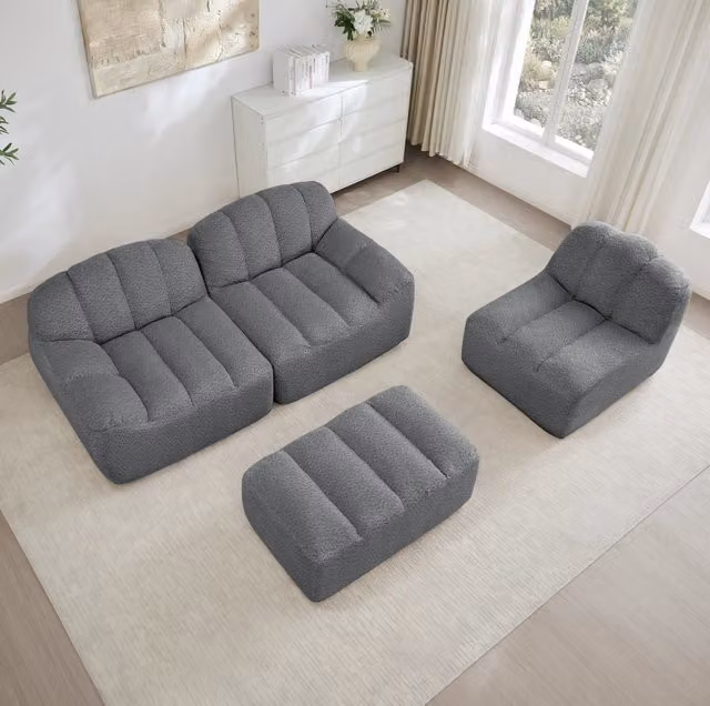 Divano modulare angolare senza struttura con ottomana; schiuma 32D e pile granulato; grigio