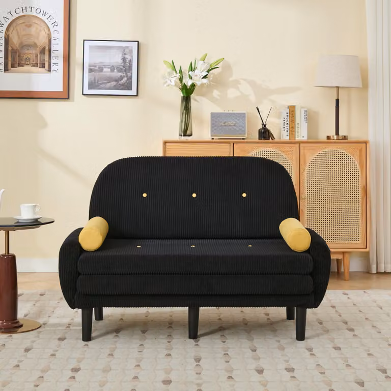 Divano a due posti imbottito in tessuto nero, ideale per il soggiorno, utilizzabile come chaise longue e poltrona relax, con spazio contenitivo.