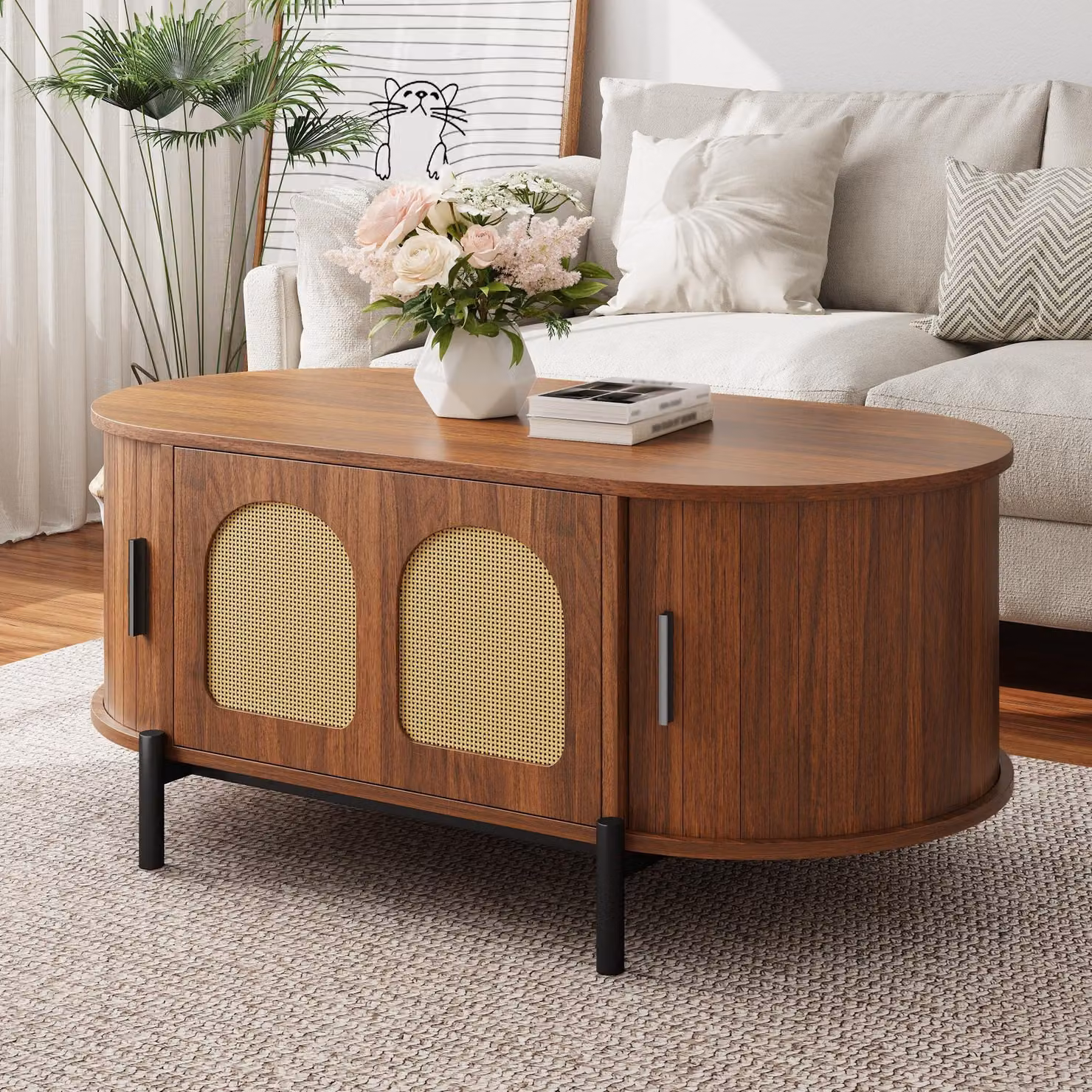 Tavolino Moonbite, noce, forma ovale, 100 cm. Ante in rattan, tavolino da soggiorno con ante scorrevoli, vano contenitivo diviso, gambe in metallo nero, pannello in MDF, finitura noce