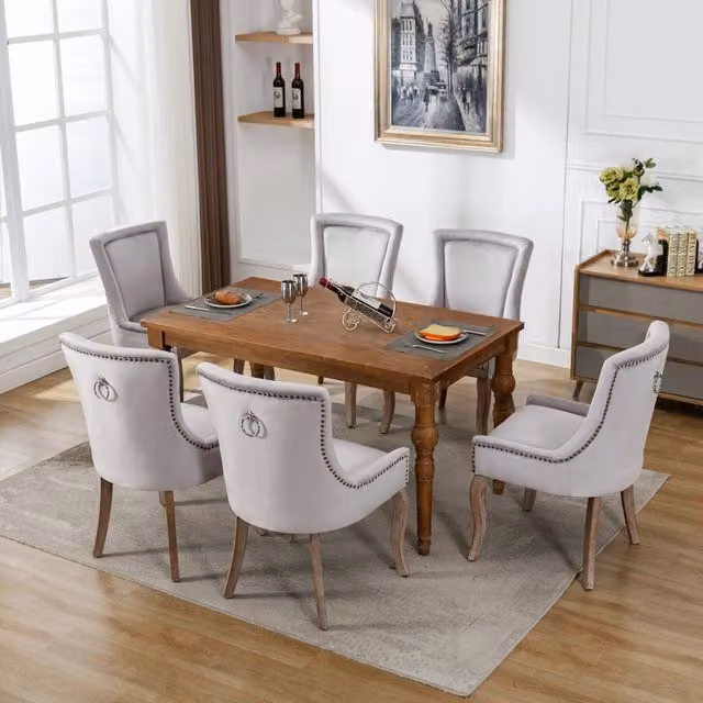 Sedia da pranzo imbottita in velluto grigio con gambe in legno massello
