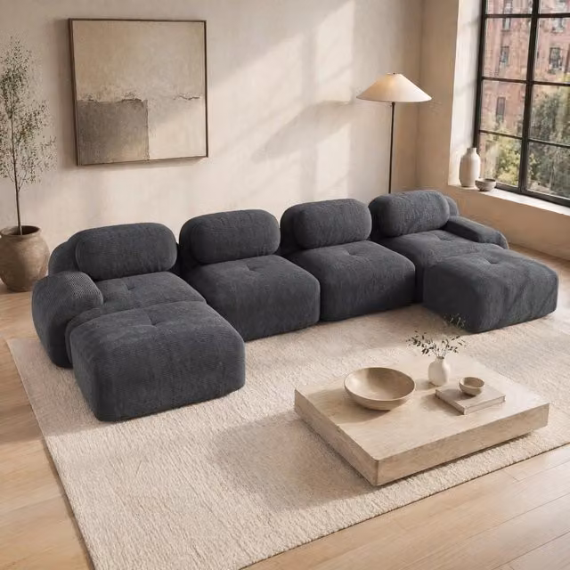 Divano angolare modulare MODFU in velluto a coste grigio con design ergonomico e struttura senza telaio