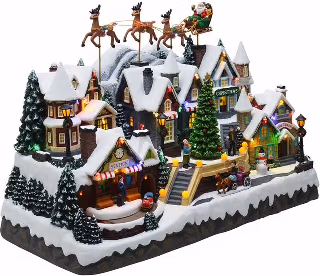 Villaggio di Natale Luminoso Saint Joy con Musica, Luci LED Multicolore, Slitta con Renne, Trenino e Albero Rotante, L/P/H: 55 x 32,5 x 37 cm