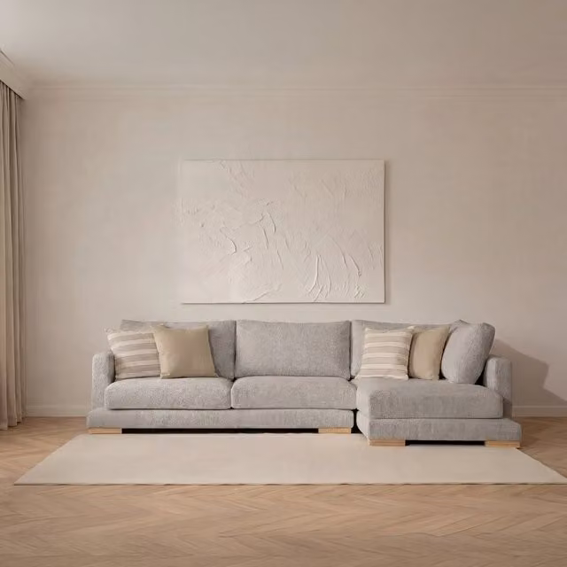 Divano chaise longue Luxor Living a 4 posti con configurazione a L e lato destro, colore perla, design moderno con rivestimento in tessuto e cuscini inclusi