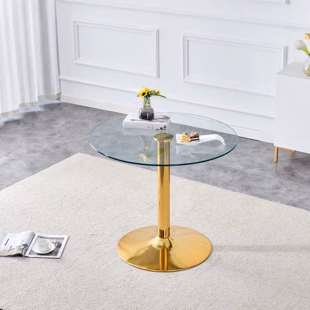 Tavolo da bar tondo con piano in vetro temperato trasparente Ø 85 cm e base in metallo dorato