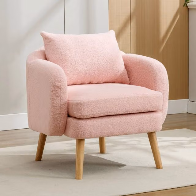 Poltrona relax OKWISH in tessuto boucle rosa con struttura in legno massello e seduta imbottita per il tuo soggiorno