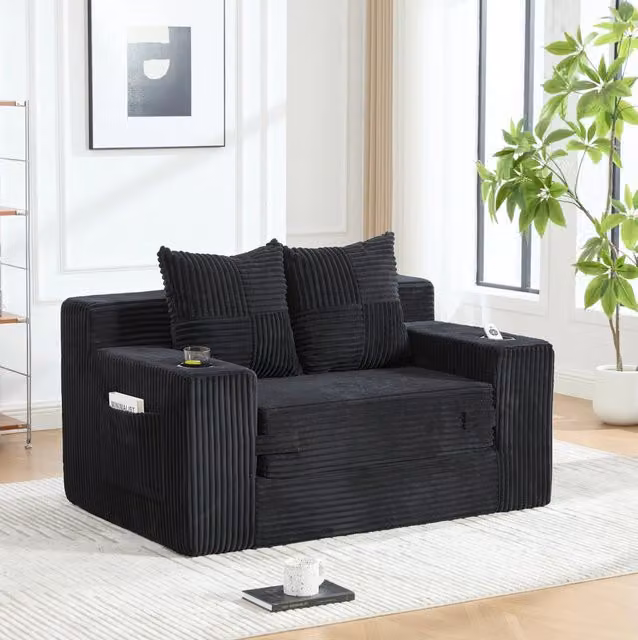 Divano pouf in velluto a coste nero 151x133 cm con tasche laterali e 2 cuscini HOMVRA
