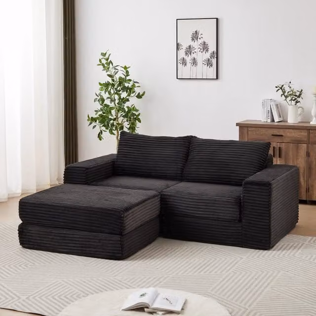 Divano letto modulare Mivray in velluto a coste nero con poggiapiedi coordinato e funzione notte per soggiorno