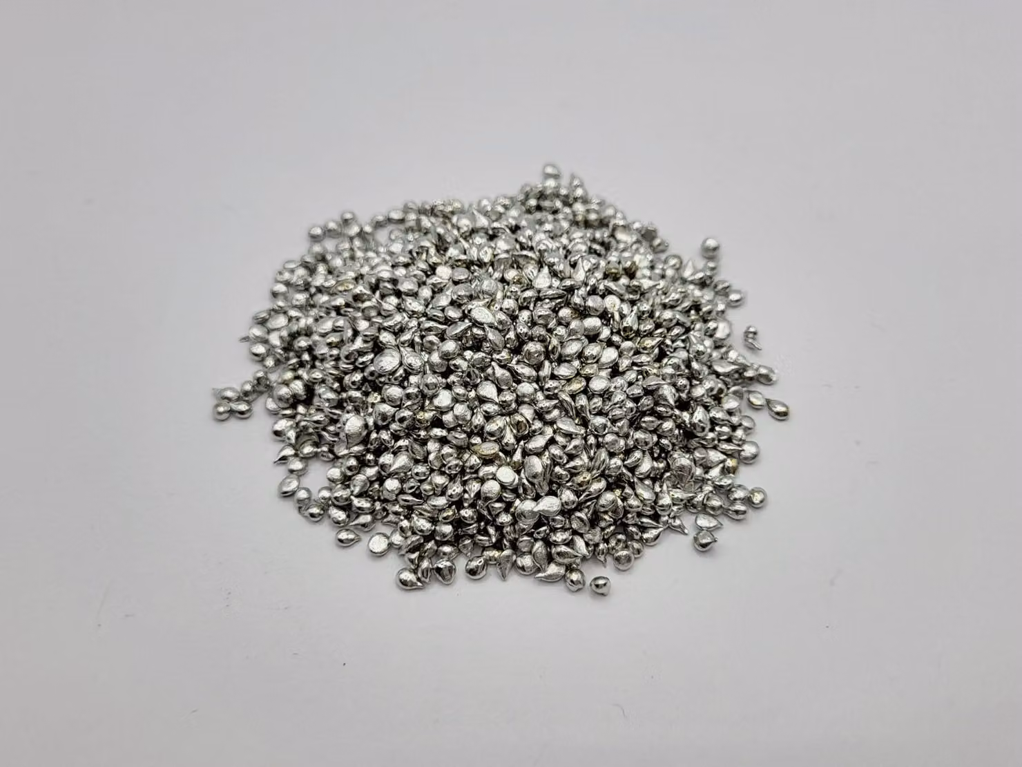 Stagno Sn99,9 % in granulato grosso, peso: 1 kg