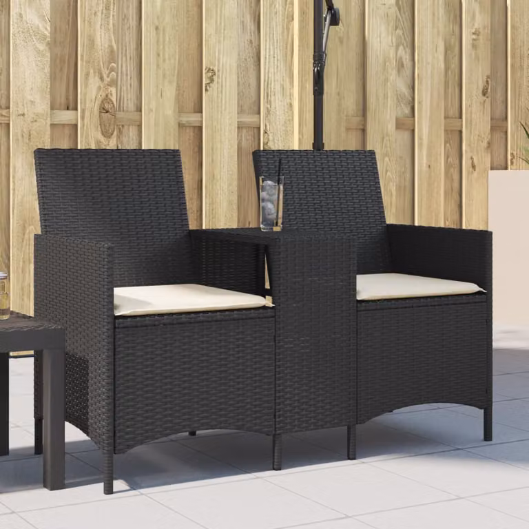 Set da giardino vidaXL composto da divano a 2 posti con tavolo e cuscini in polyrattan nero e bianco con struttura in metallo