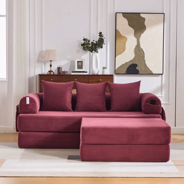 Divano modulare con pouf in velluto a coste; struttura in metallo e tasca laterale; rosso vino